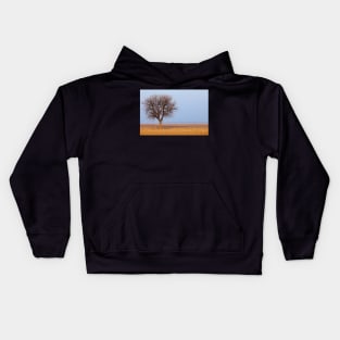 Single tree in plow land Kids Hoodie